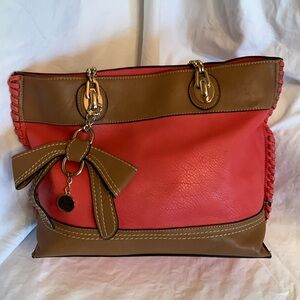 Coral and tan tote bag. Lots of pockets and space. Carmelo brand